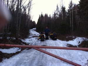 Mike Stewart { at the sleds } and Scott Ballard locking the gates April 15, 2013. This gate is on the south end of the Grouse Hill Road, on the Green Mountain Snofliers trails.